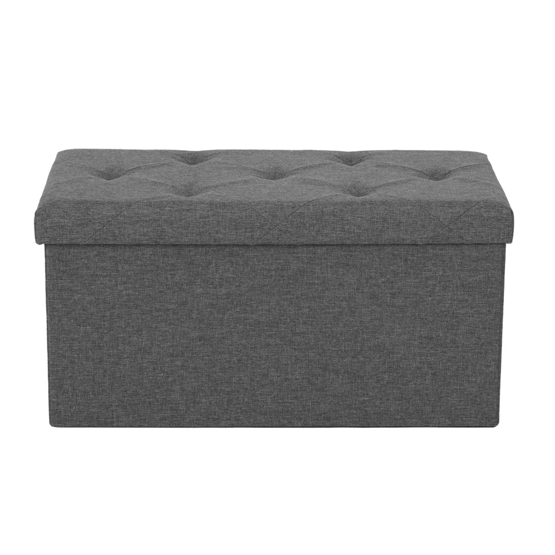 OSLO folding storage bench in grey at the end of a bed