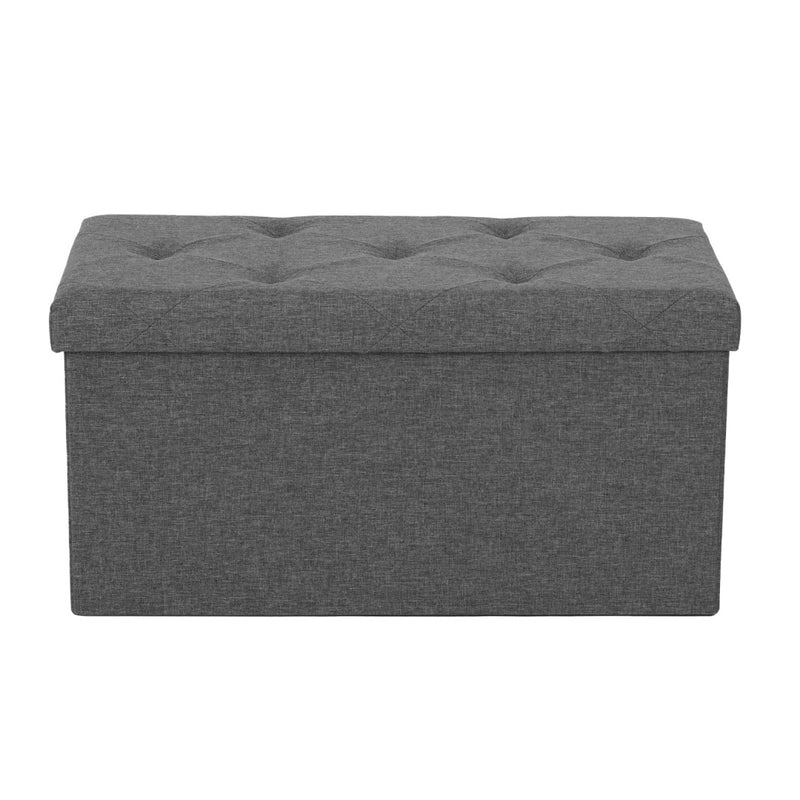 OSLO folding storage bench in grey at the end of a bed